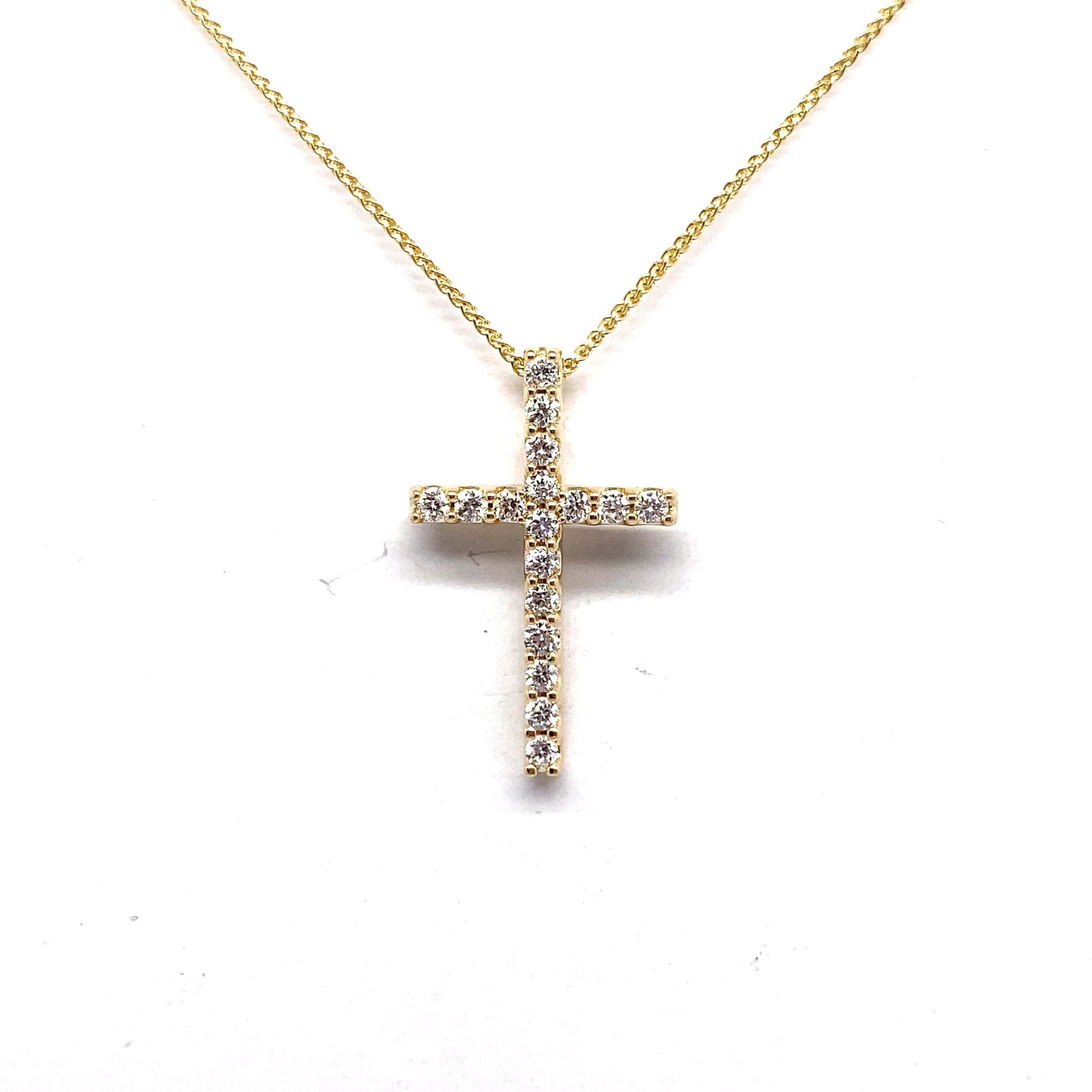 14K Yellow Gold necklace with a 1/4 CT TW Natural Round Brilliant Diamond Accent Cross Pendant against a white background.