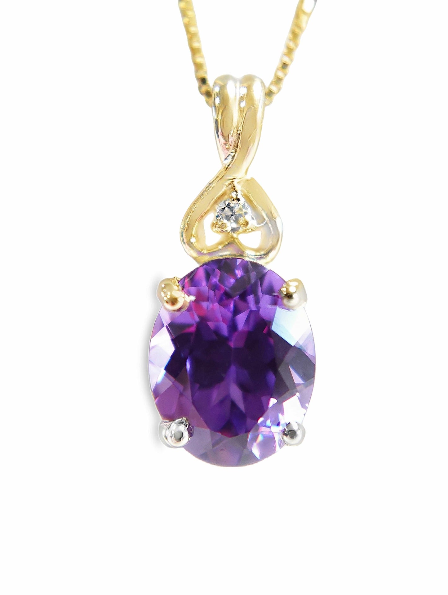 10KY 10X8 OVAL PURPLE SAPPHIRE CENTER .05CT DIAMOND PENDANT
