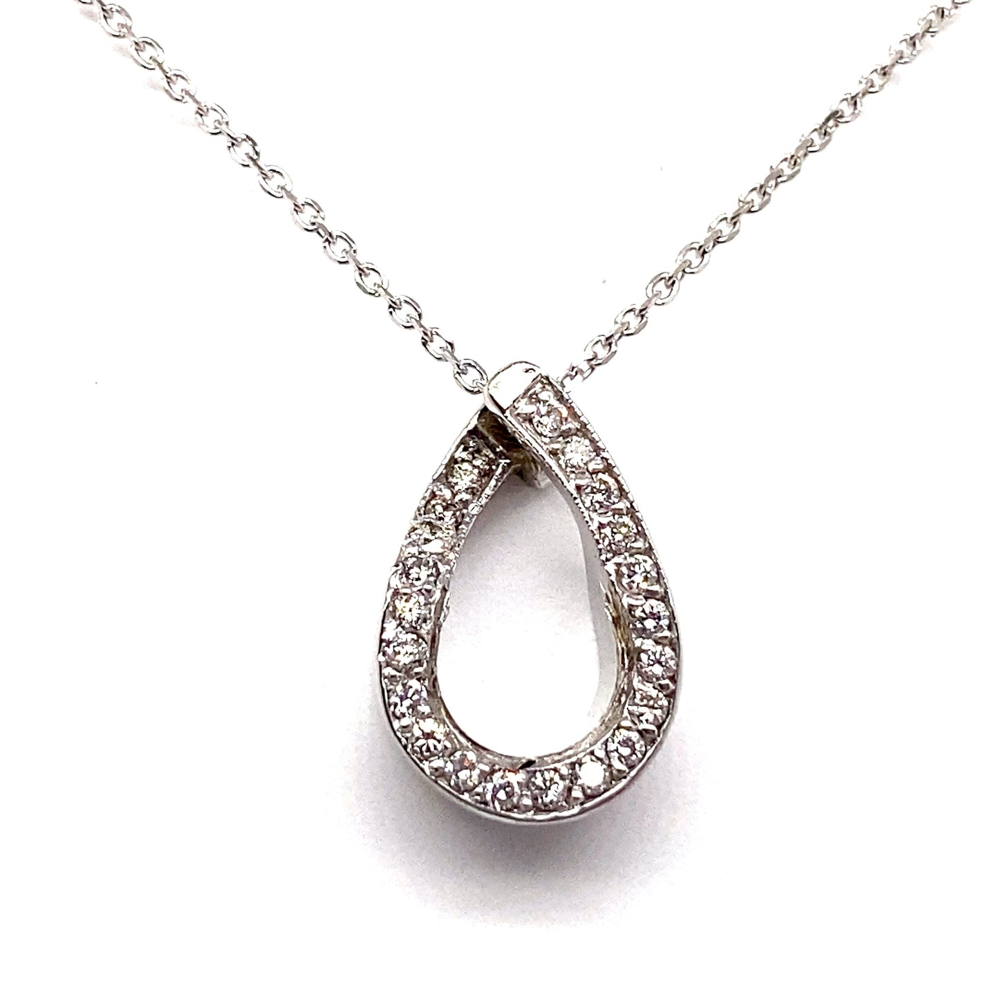 14K white gold necklace with a teardrop-shaped pendant features 1/4 ct TW natural round brilliant diamond pave, enhancing its elegance.