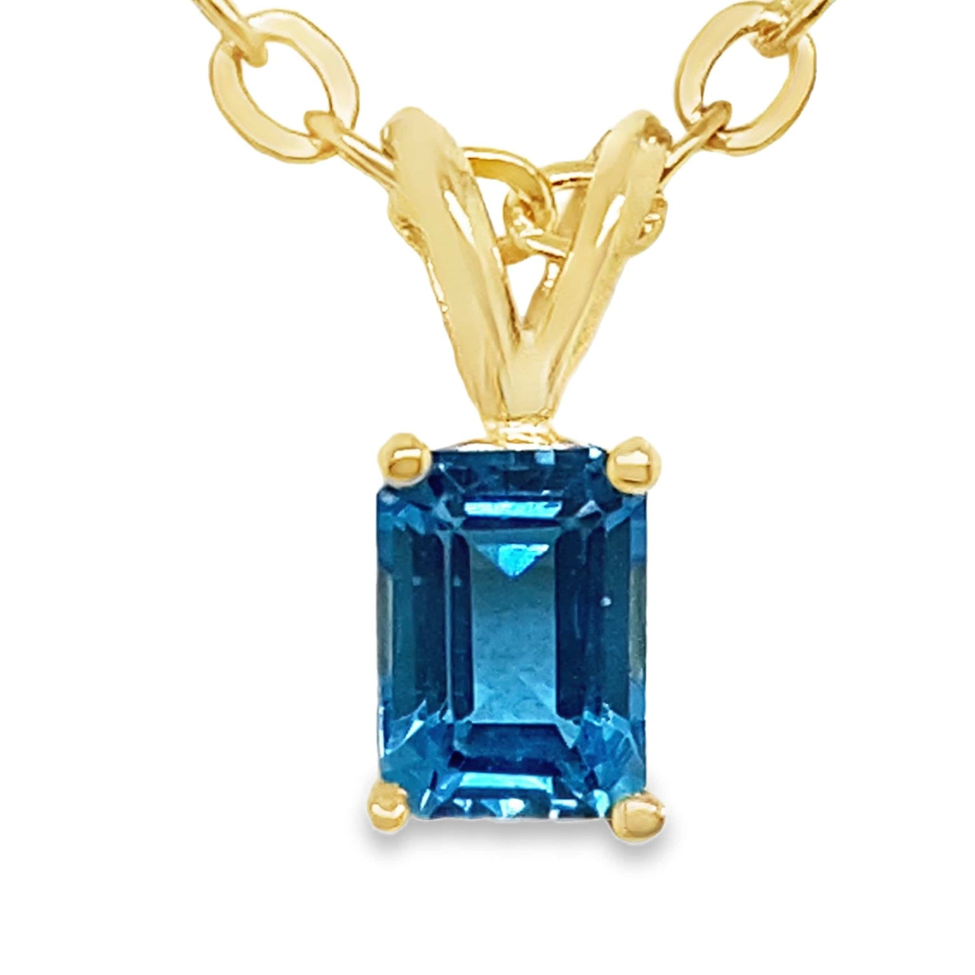 14KY 7X5MM EMERALD CUT SWISS BLUE TOPAZ SOLITAIRE PENDANT
