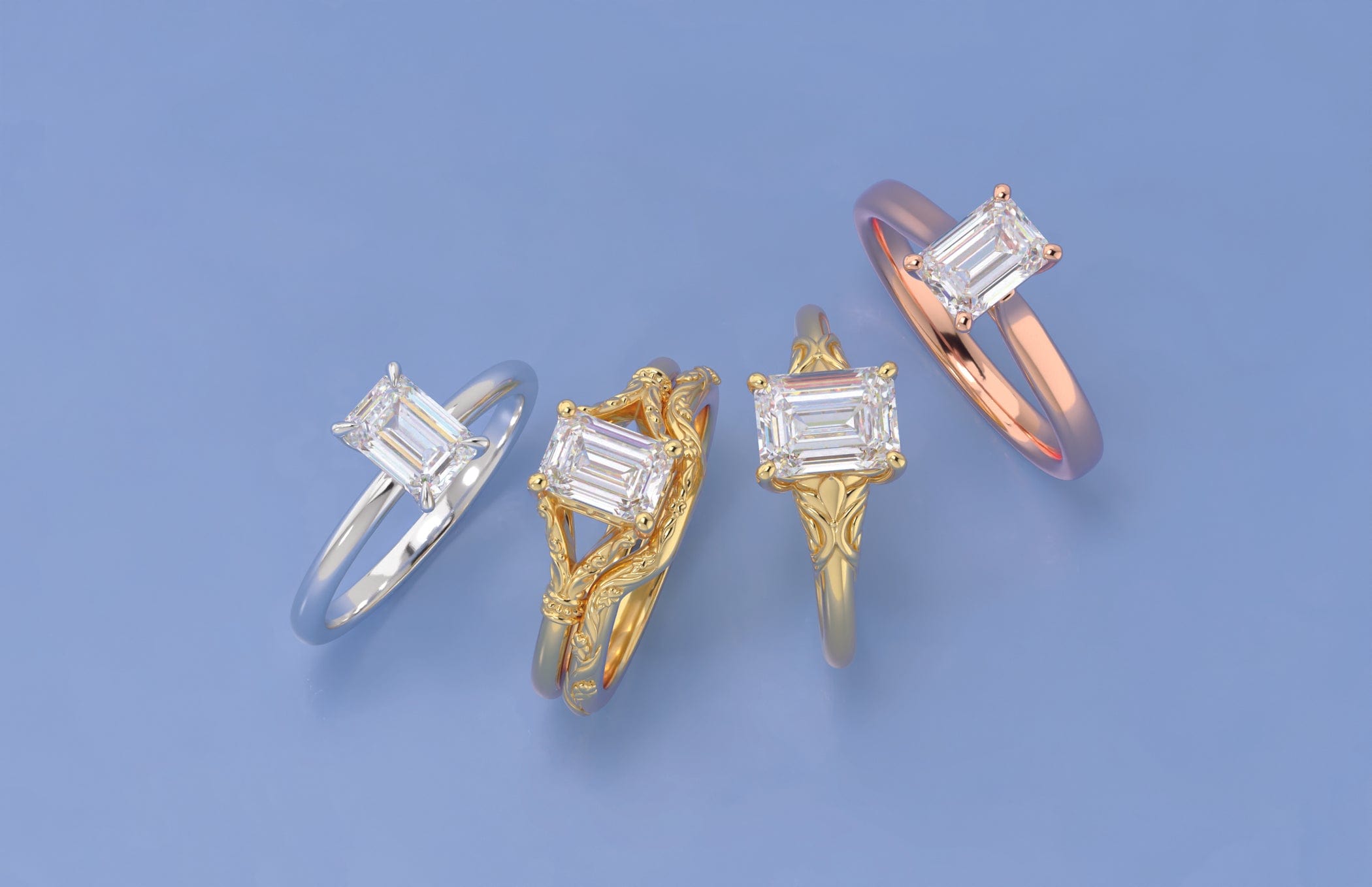 Four natural diamond engagement rings in different colors on a blue background