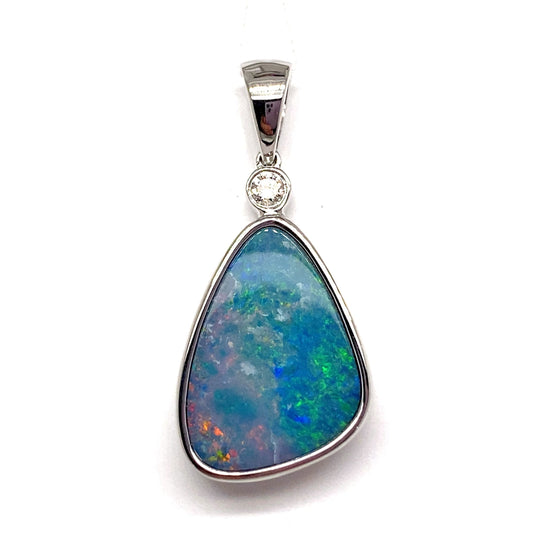 This exquisite piece of jewelry is a 14K white gold pendant featuring a captivating 5.27 ct double opal center with vibrant blue and green hues, complemented by a 0.072 ct TW natural diamond accent that enhances the opal's allure.