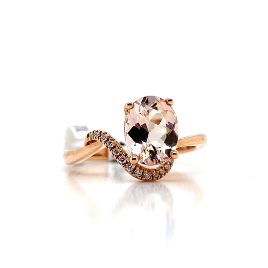 A 14K white gold ring showcasing a stunning 1.58 CT morganite center and 0.078 TW natural diamond accents, perfect for enhancing any jewelry collection with its graceful wave design.