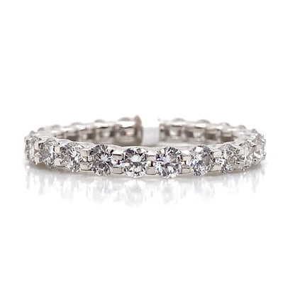 A 14K white gold eternity band, adorned with a continuous line of sparkling round stones, exemplifies sustainable craftsmanship by featuring 1.94 carat total weight lab-grown diamonds.