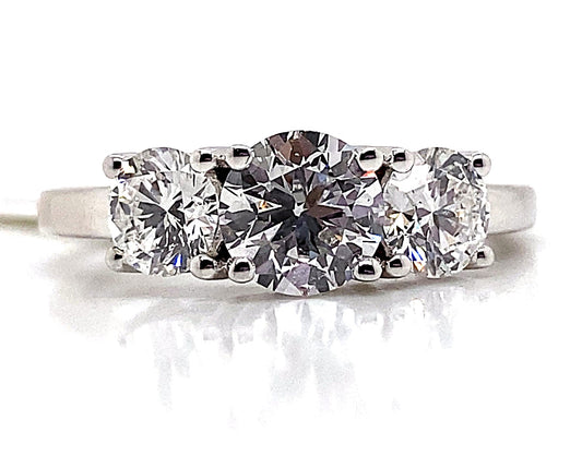 This exquisite ring, named the "14K White Gold 2.0 ct tw Lab Grown Diamond Three Stone Style Ring," showcases a captivating 3-stone design with round-cut lab-grown diamonds elegantly set in a 14K white gold band.