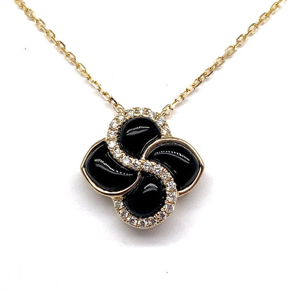 14K white gold necklace featuring a 1.35 TW inlay onyx clover-shaped pendant, accented with .14 CT TW natural diamonds.