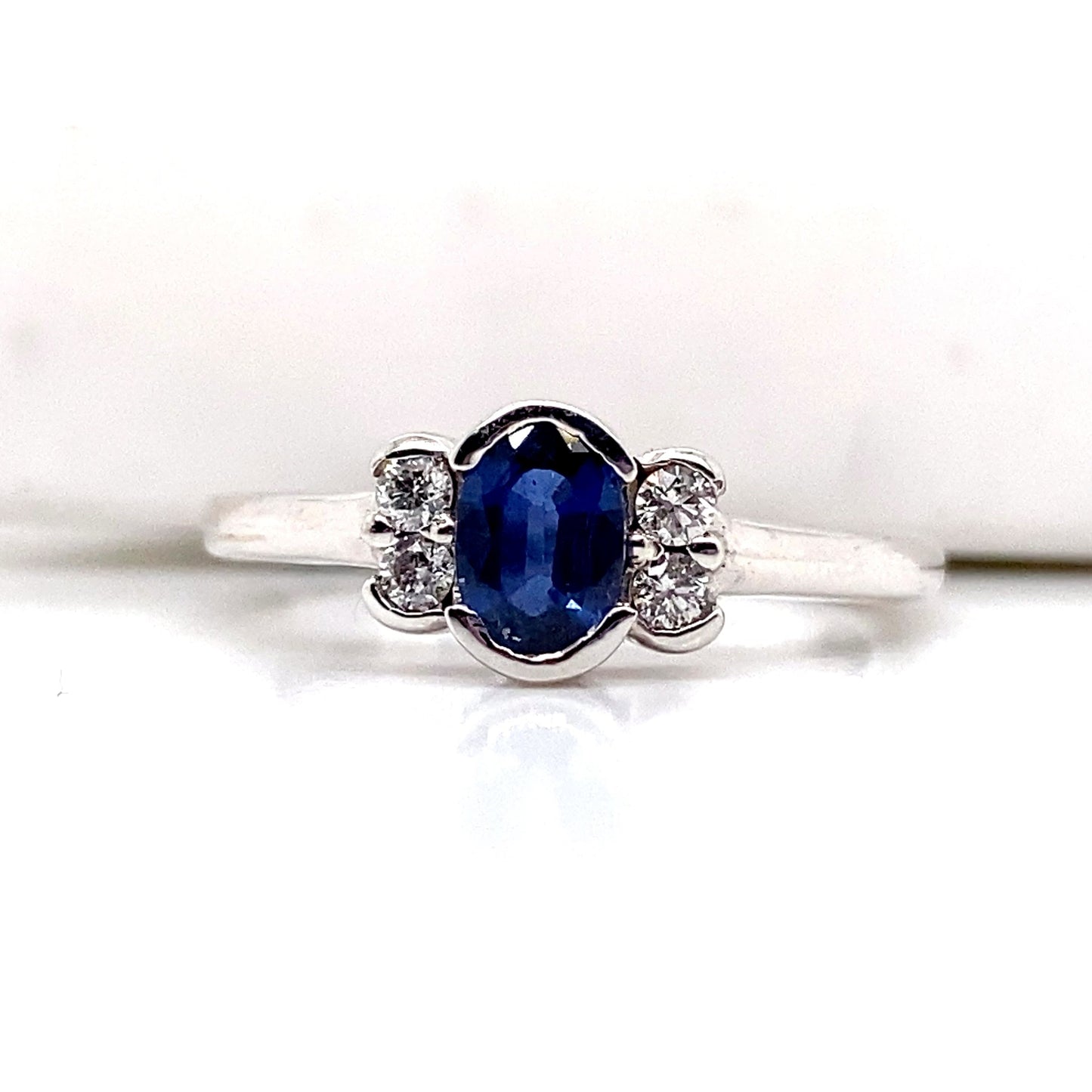 aster jewels 14k white gold   .68 ct natural  blue sapphire center    .12 ct tw round brilliant natural diamond accent   fashion ring