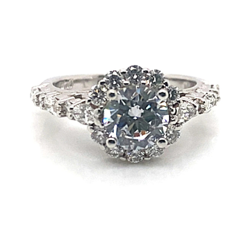 The engagement ring, named the "14K White Gold CZ Center (7.5 mm RBC) .87 ct TW Natural Round Brilliant Diamond Accent," showcases a stunning CZ centerpiece complemented by natural round brilliant diamond accents on a sophisticated white gold band.