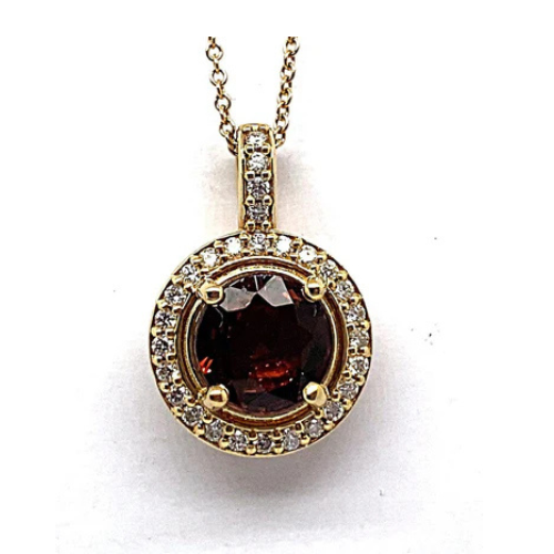 14K Yellow Gold Necklace featuring a 2.48 carat Rubellite Tourmaline gemstone at its center, beautifully accented with .40 carat total weight of natural round brilliant diamonds in a halo style pendant on a delicate chain.