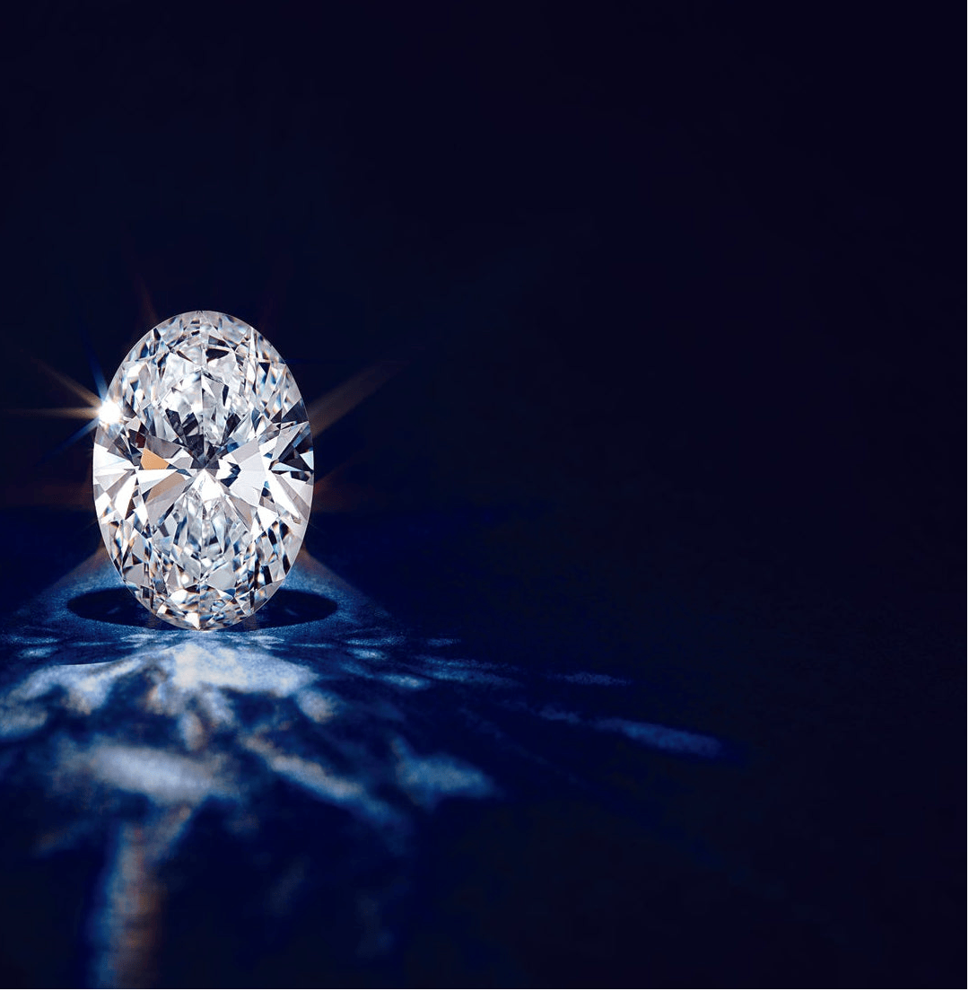 lab grown diamond sparkling on blue surface