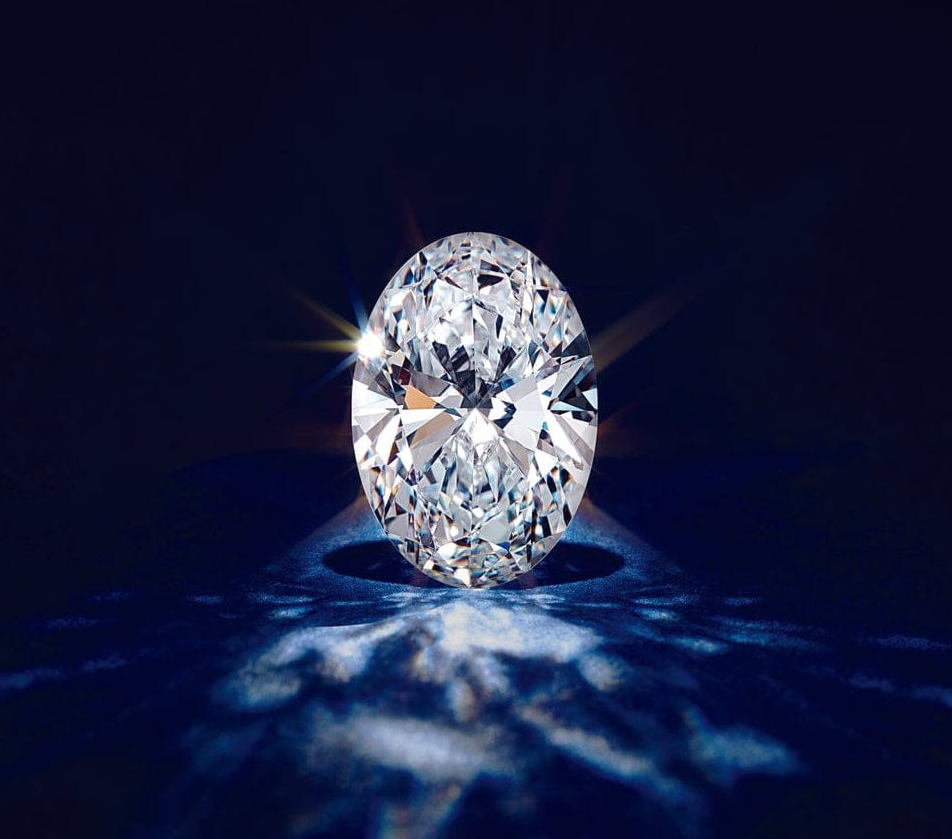 Oval-shaped LAB diamond on a dark background