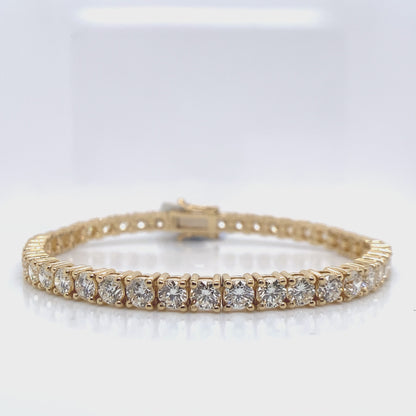 18K YELLOW  9.30 CT TW NATURAL ROUND BRILLIANT DIAMOND  F-G/VVS-VS  7" LENGTH  PRONG SET TENNIS BRACELET