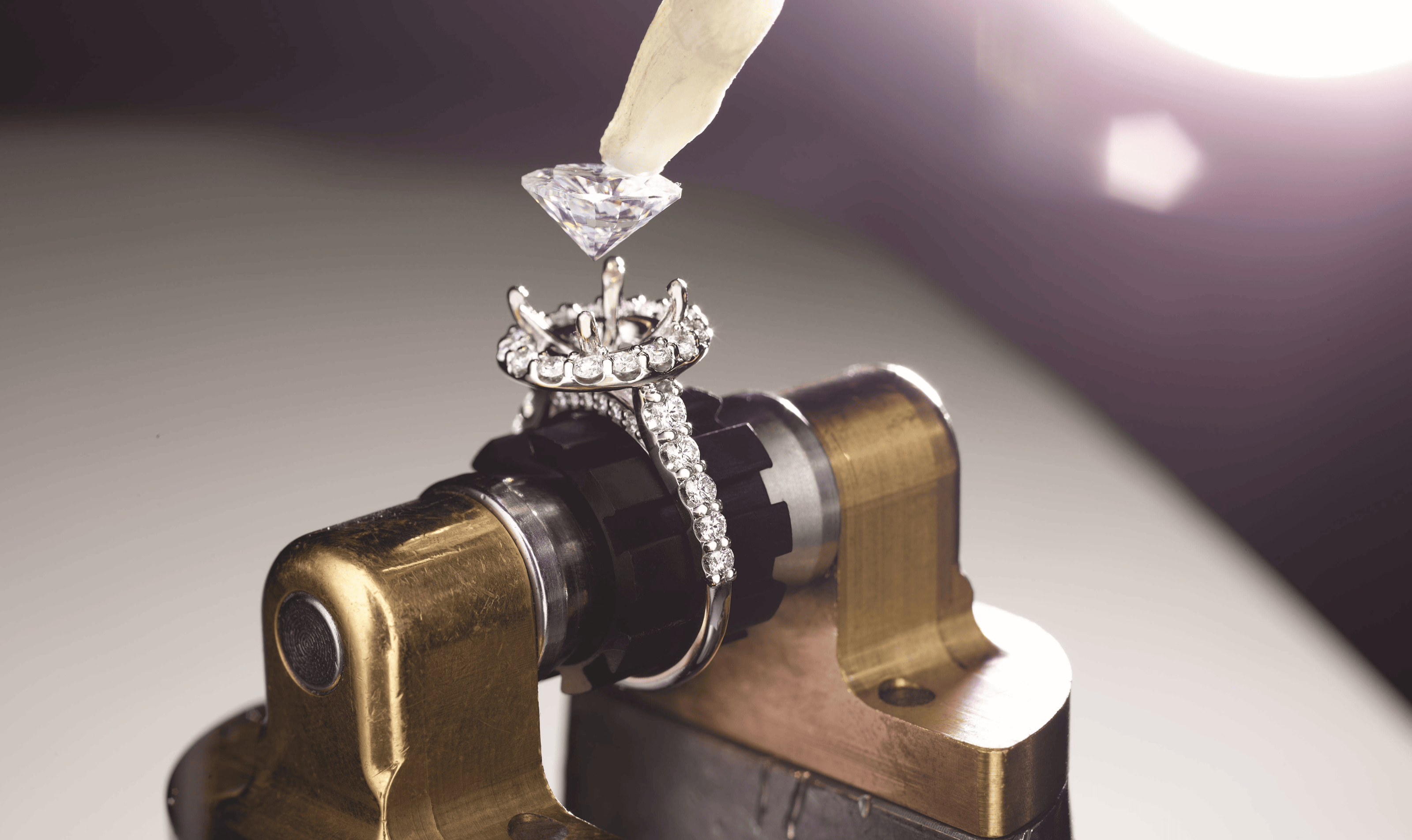 Diamond ring on a metal stand with a blurred background