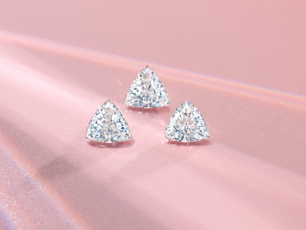 trillion cut diamonds on pink surface